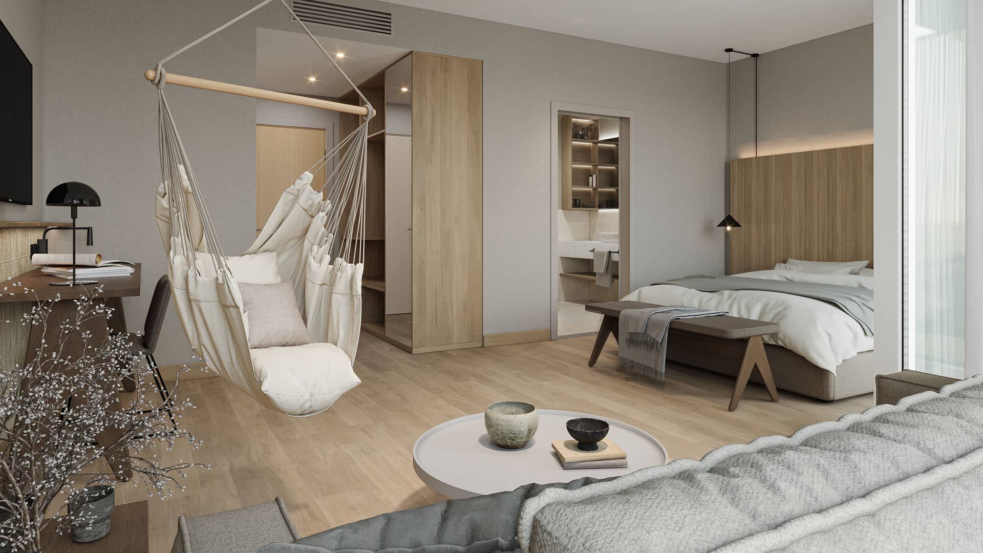 Doppelbett, eine Sitzecke und eine Schaukel in einem beigefarbenen Zimmer in einem Lifestyle-Hotel